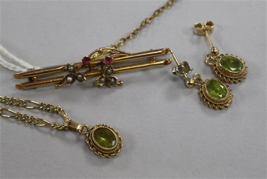 A 9ct gold gem set pendant on chain and matching earrings and a 9ct gold bar brooch.